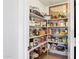 Walk-in pantry with fully stocked shelves, showcasing an organized storage solution for all your culinary needs and essentials at 4401 E Barwick Dr, Cave Creek, AZ 85331