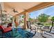 Inviting covered patio featuring comfortable seating, stylish décor, and a serene outdoor ambiance at 4401 E Barwick Dr, Cave Creek, AZ 85331
