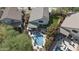 An aerial shot showcases a private pool, landscaped yard, and covered patio at 4554 E Coyote Wash Dr, Cave Creek, AZ 85331