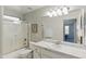 Well-lit bathroom featuring a bathtub and marble countertop at 4554 E Coyote Wash Dr, Cave Creek, AZ 85331
