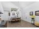 Elegant dining room with high ceilings, wood floors, and a stylish chandelier for memorable meals at 4554 E Coyote Wash Dr, Cave Creek, AZ 85331