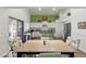 Bright eat-in kitchen with white cabinets, stainless steel appliances, and a sliding door to the outdoor space at 4554 E Coyote Wash Dr, Cave Creek, AZ 85331