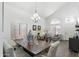 Cozy dining space with seating area bathed in natural light, complemented by stylish decor and vaulted ceilings at 4554 E Coyote Wash Dr, Cave Creek, AZ 85331
