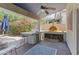 Outdoor kitchen featuring a grill and pizza oven, ideal for entertaining at 4554 E Coyote Wash Dr, Cave Creek, AZ 85331