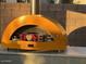 Stylish outdoor pizza oven with decorative 'LOVE' sign, perfect for entertaining guests at 4554 E Coyote Wash Dr, Cave Creek, AZ 85331