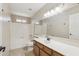 Bathroom with a single sink, a vanity and a shower-tub combo and neutral colors at 4808 E Betty Elyse Ln, Scottsdale, AZ 85254
