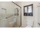 Bathroom featuring a glass door shower, built in storage cubbies and safety bar at 4808 E Betty Elyse Ln, Scottsdale, AZ 85254