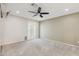 Bedroom with neutral walls, carpet, ceiling fan and window with blinds at 4808 E Betty Elyse Ln, Scottsdale, AZ 85254