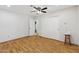 Bedroom with wood floors, a fan, an closet, and a stool at 4808 E Betty Elyse Ln, Scottsdale, AZ 85254