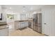 Bright kitchen with stainless steel appliances, granite countertops, and white cabinets at 4808 E Betty Elyse Ln, Scottsdale, AZ 85254