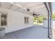 Covered patio with ceiling fans offering a view of the backyard and lush landscape at 4808 E Betty Elyse Ln, Scottsdale, AZ 85254