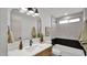 Modern bathroom features a quartz countertop, sleek fixtures, and a shower-over-tub combo at 5109 E Blanche Dr, Scottsdale, AZ 85254