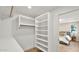 Walk-in closet with custom shelving and storage, leading to the main bedroom at 5109 E Blanche Dr, Scottsdale, AZ 85254
