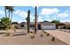 Attractive single-story home with desert landscaping, a two-car garage, and a well-maintained front yard at 5109 E Blanche Dr, Scottsdale, AZ 85254
