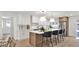 Bright, modern kitchen featuring white cabinets, stainless steel appliances, and a spacious center island with bar stool seating at 5109 E Blanche Dr, Scottsdale, AZ 85254