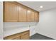 Laundry room with wooden cabinets, a white countertop, and washer/dryer hookups at 5109 E Blanche Dr, Scottsdale, AZ 85254