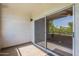 Enclosed balcony offering an inviting space with sliding glass doors and views of the outdoors at 5345 E Van Buren St # 305, Phoenix, AZ 85008