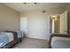 Cozy bedroom featuring twin beds and neutral decor, creating a serene and inviting atmosphere at 5345 E Van Buren St # 305, Phoenix, AZ 85008