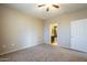 Light filled bedroom with ceiling fan and two doorways at 5345 E Van Buren St # 305, Phoenix, AZ 85008