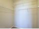Walk-in closet with ample shelving space for organized storage and wardrobe display at 5345 E Van Buren St # 305, Phoenix, AZ 85008