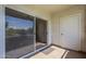 Cozy covered patio with sliding glass door leading to the interior at 5345 E Van Buren St # 305, Phoenix, AZ 85008