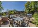 Pool area with outdoor seating, dining table, grill, and lush greenery for a resort-like experience at 5345 E Van Buren St # 305, Phoenix, AZ 85008