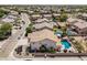 Neighborhood view featuring a home with a pool and meticulously landscaped backyard at 551 E Sun Valley Farms Ln, San Tan Valley, AZ 85140