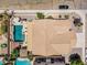 Aerial view showcases a well-maintained house with a stunning backyard and pool at 551 E Sun Valley Farms Ln, San Tan Valley, AZ 85140