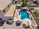 Aerial view of backyard featuring pool, gazebo, outdoor kitchen and lounge area at 551 E Sun Valley Farms Ln, San Tan Valley, AZ 85140