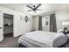 Cozy bedroom with paneled walls and a walk-in closet for ample storage at 551 E Sun Valley Farms Ln, San Tan Valley, AZ 85140