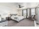 Bright bedroom with a ceiling fan, carpet, and a big window for natural light at 551 E Sun Valley Farms Ln, San Tan Valley, AZ 85140