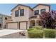 Beautiful home with a well-manicured front yard and desert landscaping at 551 E Sun Valley Farms Ln, San Tan Valley, AZ 85140