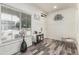 Bright foyer with wood-look flooring, stylish decor, and a view of the front yard at 551 E Sun Valley Farms Ln, San Tan Valley, AZ 85140