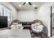 Modern home office showcasing a wood desk and wicker chairs at 551 E Sun Valley Farms Ln, San Tan Valley, AZ 85140