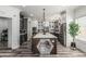 Open kitchen features white cabinets, stainless steel appliances, and a large center island at 551 E Sun Valley Farms Ln, San Tan Valley, AZ 85140