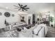 Spacious living room with neutral decor flowing into an open floor plan at 551 E Sun Valley Farms Ln, San Tan Valley, AZ 85140