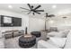 Bright living room with modern furniture and large ceiling fans at 551 E Sun Valley Farms Ln, San Tan Valley, AZ 85140