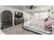 Comfortable primary bedroom with carpet, a ceiling fan, and ample closet space at 551 E Sun Valley Farms Ln, San Tan Valley, AZ 85140