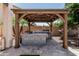 Outdoor kitchen area showcasing a built-in sink, stainless steel grill, and concrete countertops, ideal for outdoor cooking at 551 E Sun Valley Farms Ln, San Tan Valley, AZ 85140