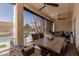 Covered patio features a dining table, ceiling fans, and backyard views at 551 E Sun Valley Farms Ln, San Tan Valley, AZ 85140