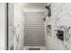 Tiled shower features a mosaic accent wall and convenient built-in niche at 551 E Sun Valley Farms Ln, San Tan Valley, AZ 85140