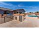 Entertainer's backyard with built-in grill, outdoor kitchen, and sparkling pool for summer fun at 5721 W Palo Verde Ave, Glendale, AZ 85302