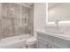 A full bathroom showcases a modern vanity and glass-enclosed shower, offering a spa-like retreat at 5721 W Palo Verde Ave, Glendale, AZ 85302