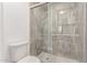 Updated bathroom features a stylish glass shower with grey tile and brushed nickel hardware at 5721 W Palo Verde Ave, Glendale, AZ 85302
