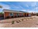 Charming brick home featuring a well-maintained yard and shuttered windows at 5721 W Palo Verde Ave, Glendale, AZ 85302