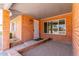 Welcoming front porch with brick facade, window and covered entryway at 5721 W Palo Verde Ave, Glendale, AZ 85302