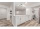 Bright kitchen featuring white cabinets, a counter, and stainless steel appliances at 5721 W Palo Verde Ave, Glendale, AZ 85302