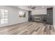 Inviting living room with cozy fireplace, built-in shelving and light wood flooring at 5721 W Palo Verde Ave, Glendale, AZ 85302