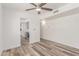 Open-concept living room featuring wood-look floors and neutral paint at 5721 W Palo Verde Ave, Glendale, AZ 85302