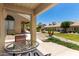 Relaxing outdoor patio with table, chairs, and manicured landscaping views at 5830 E Mckellips Rd # 120, Mesa, AZ 85215
